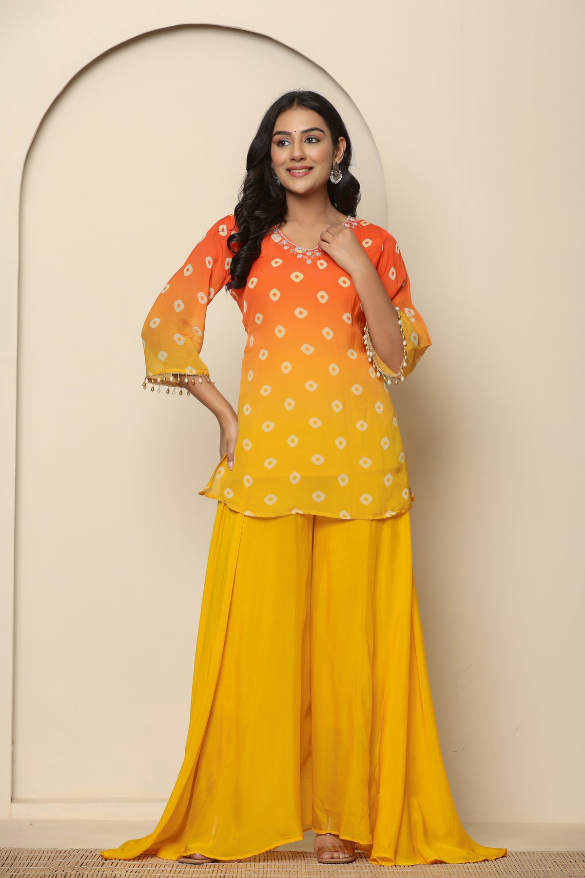 Yellow bandhani printed short kurta with palazzo and dupatta