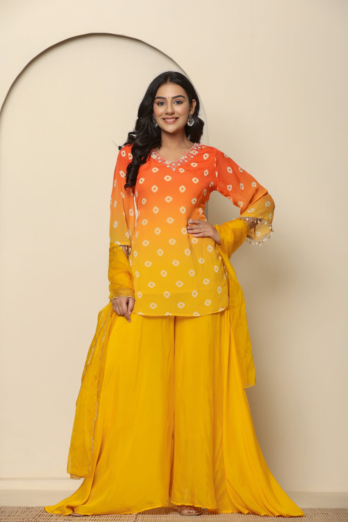 Yellow bandhani printed short kurta with palazzo and dupatta