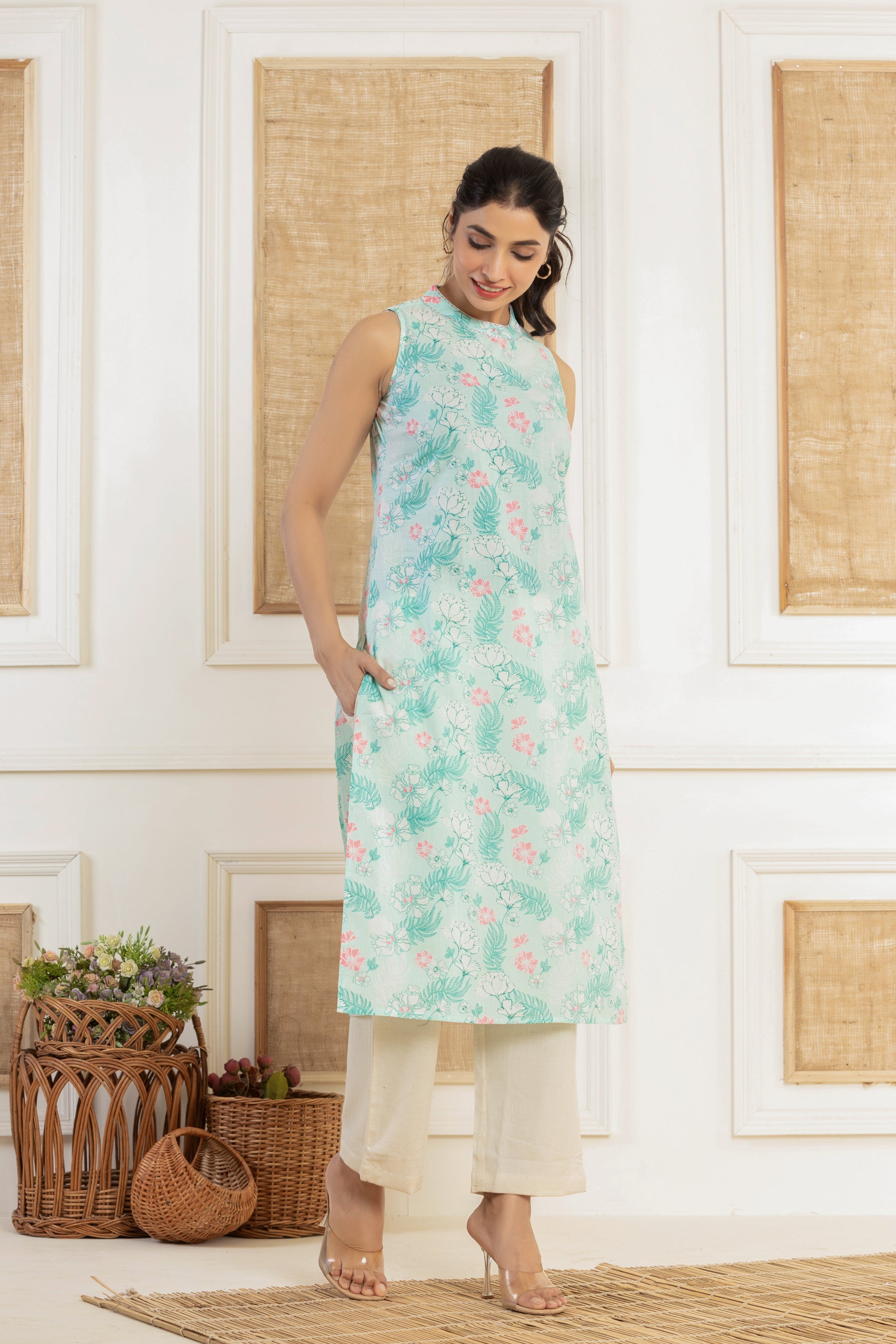 Sleeveless floral printed blue cotton kurti