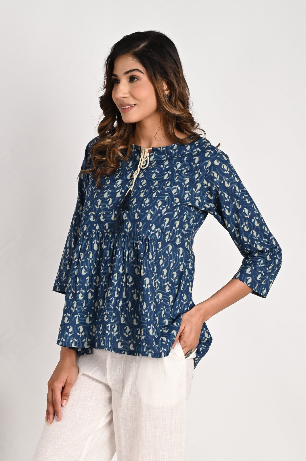 Peplum Blue Top With Tassel