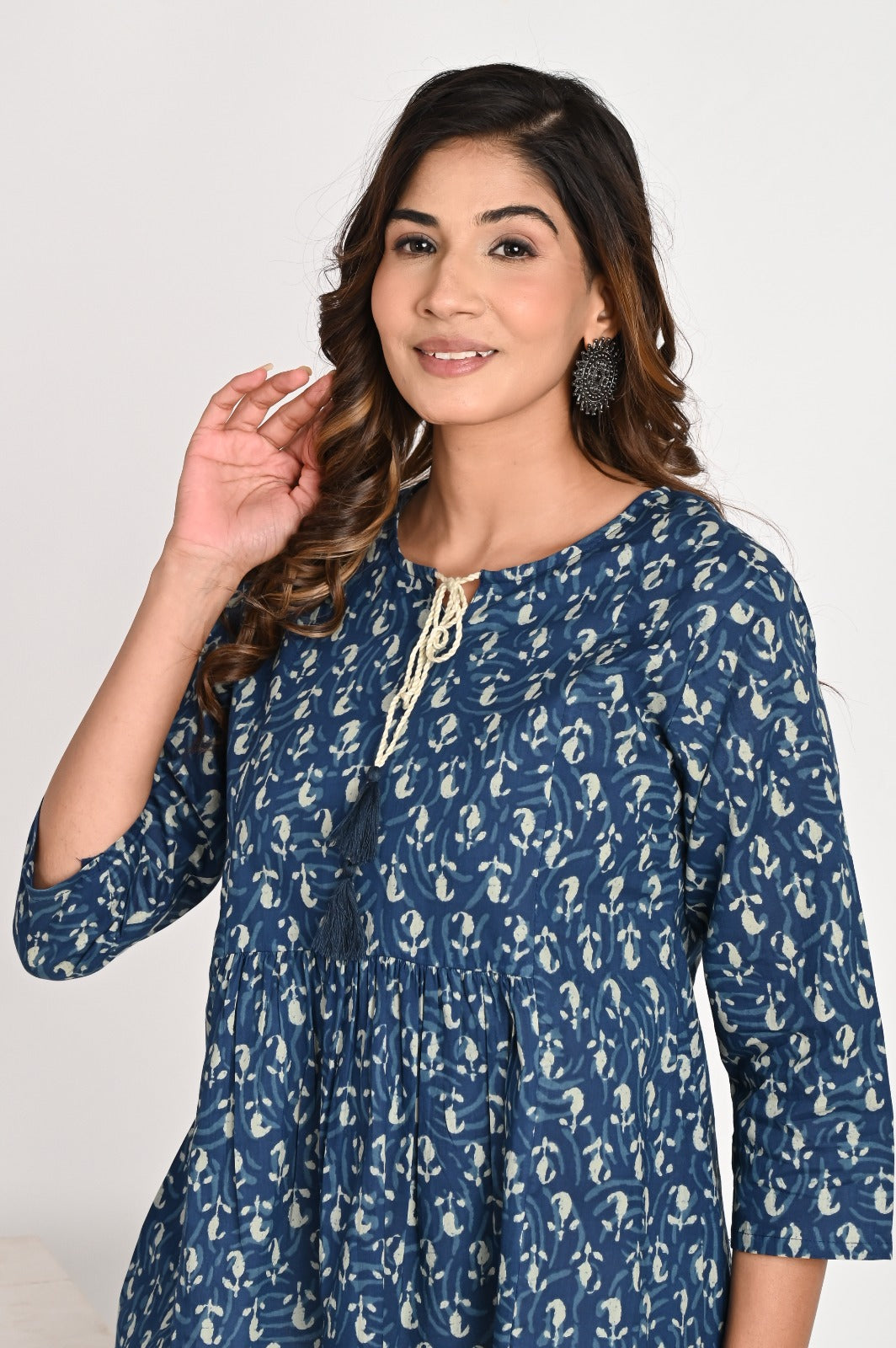 Peplum Blue Top With Tassel