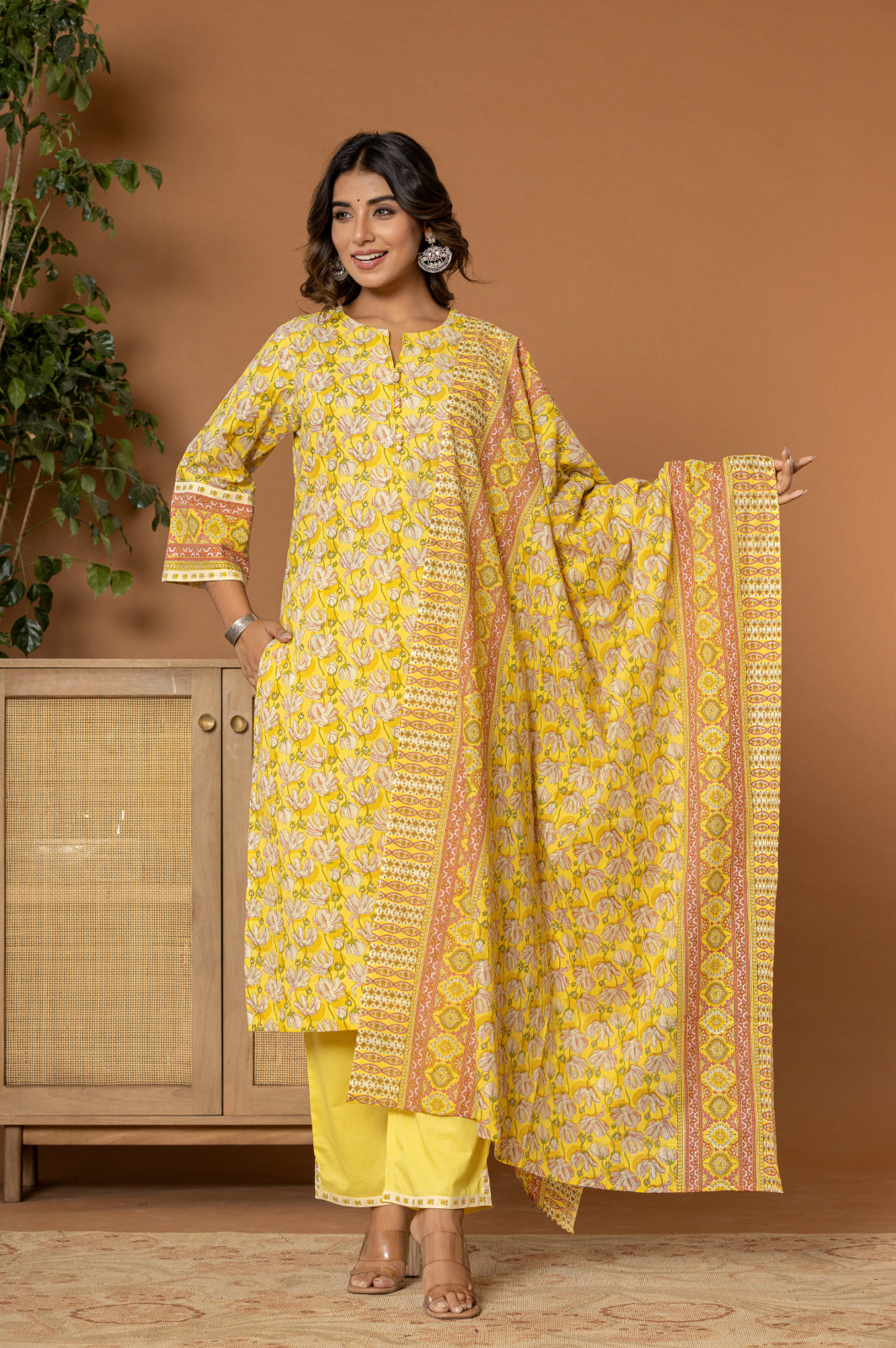 Yellow cotton floral kurta set with potli buttons