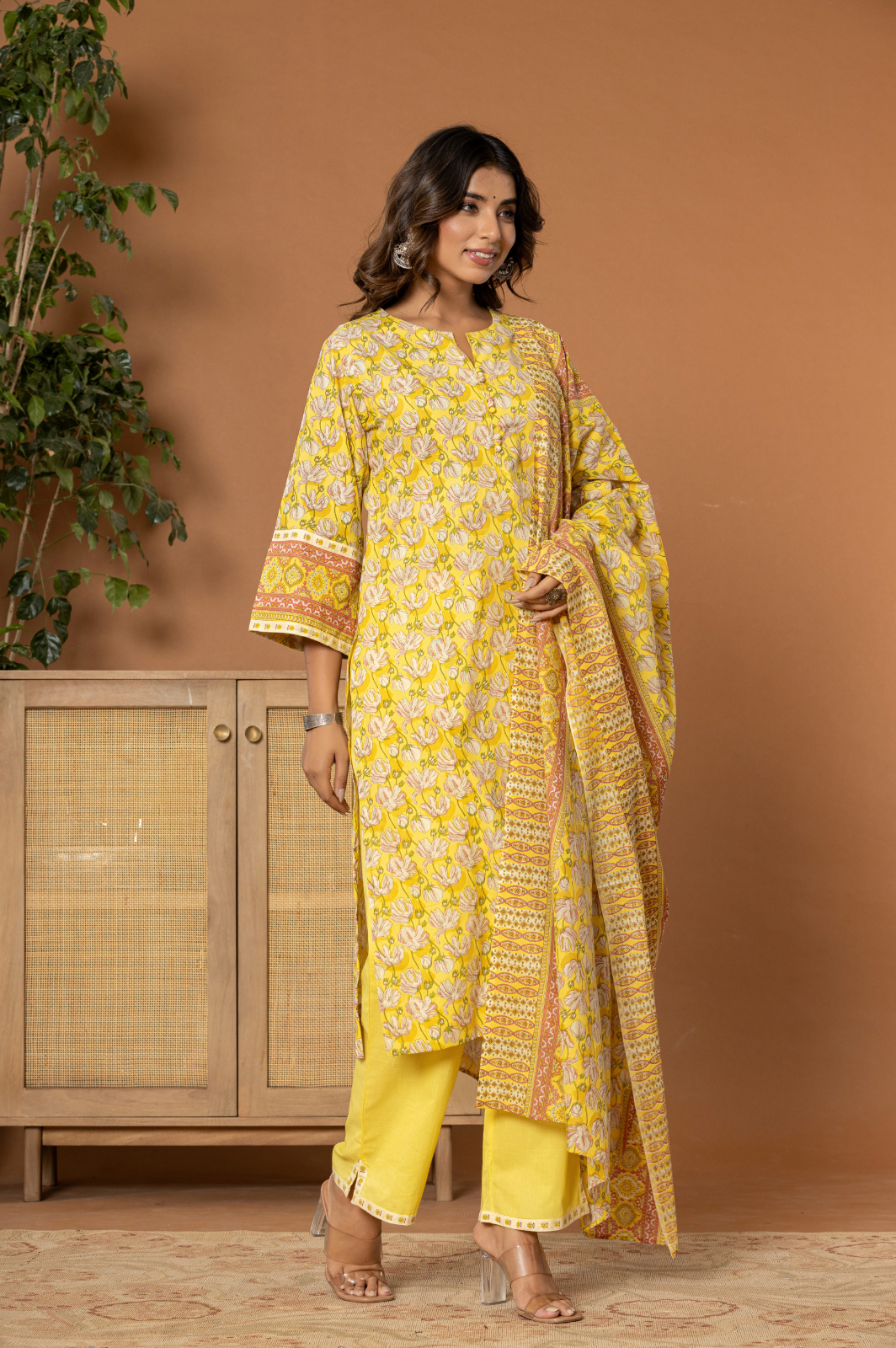 Yellow cotton floral kurta set with potli buttons