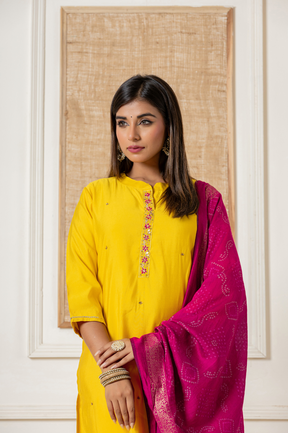 Muslin yellow kurta set with contrast bandhani dupatta