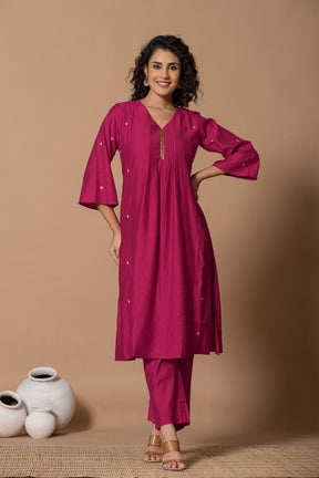 Muslin pleated solid pink kurta set with tissue dupatta